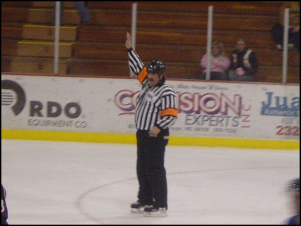 I think this is a baseball umpire that stumbled into the wrong game